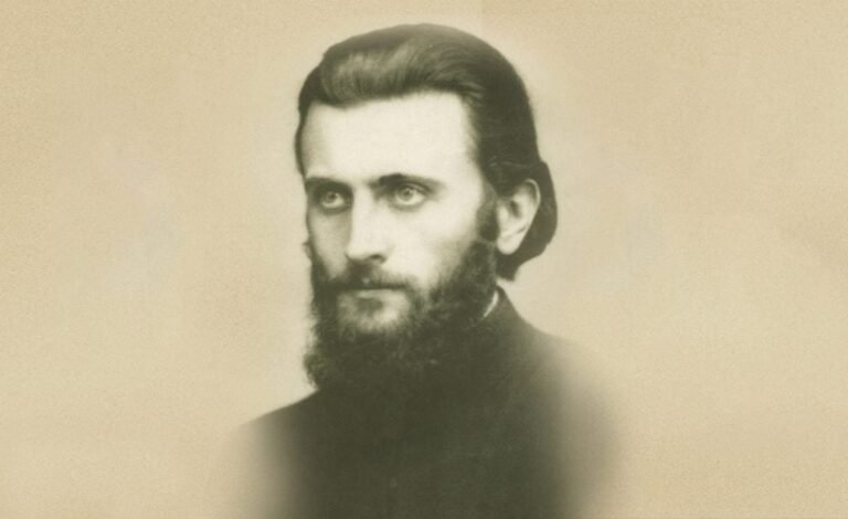 Portret fotografic sepia al lui Arsenie Boca în tinerețe